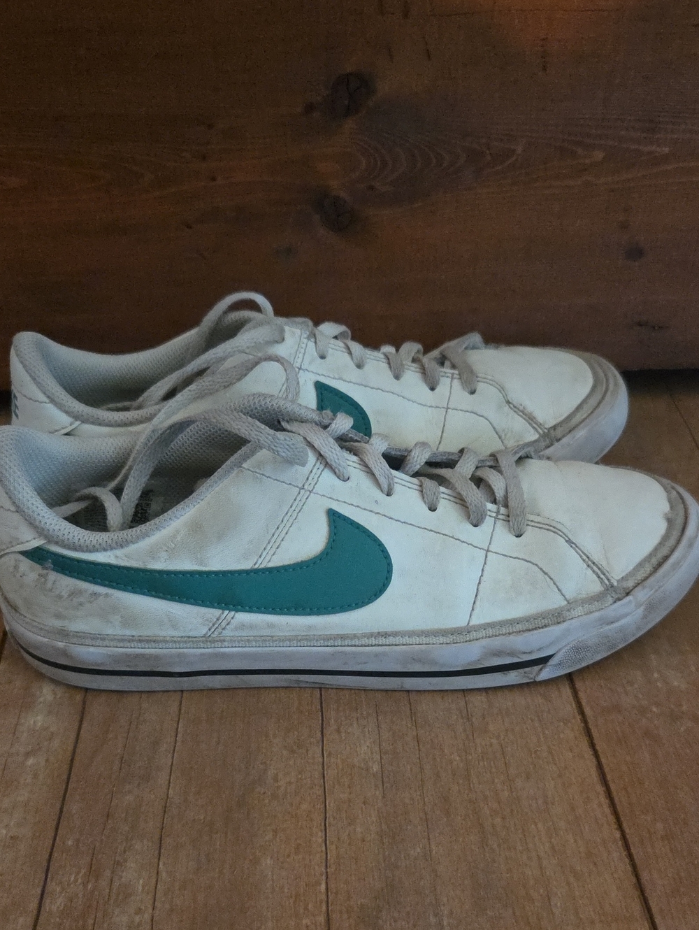 Nike White Sneakers with Green Swoosh Accent